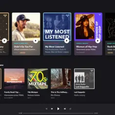 Okładki albumów i playlist muzycznych na ciemnym tle interfejsu aplikacji.